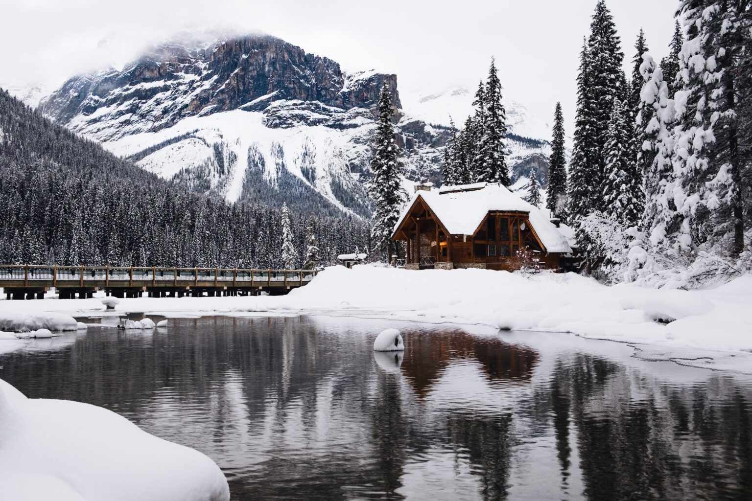 A small wooden house covered with snow near the Emerald Lake in Canada in winter